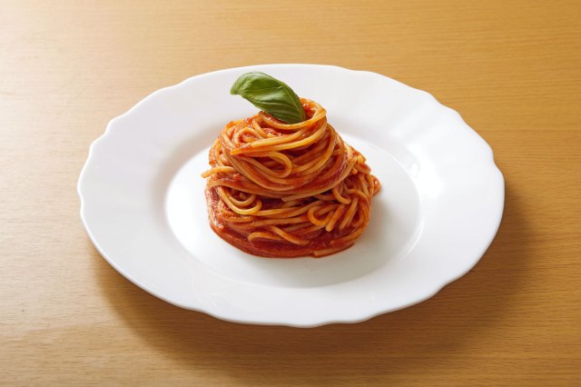 An image of a bowl of spaghetti with tomato sauce