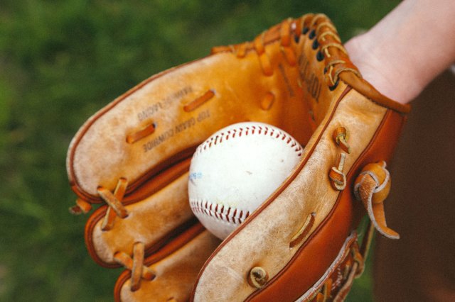 A baseball in a baseball glove