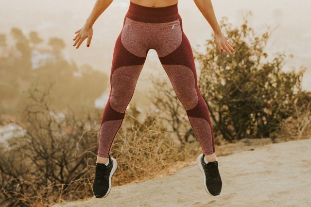 An image of a woman jumping outside