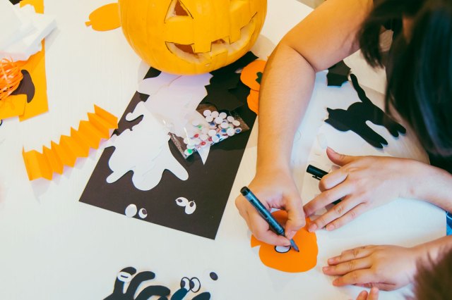 An image of people making Halloween crafts