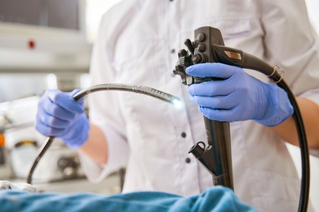 An image doctor holding endoscope during gastroscopy