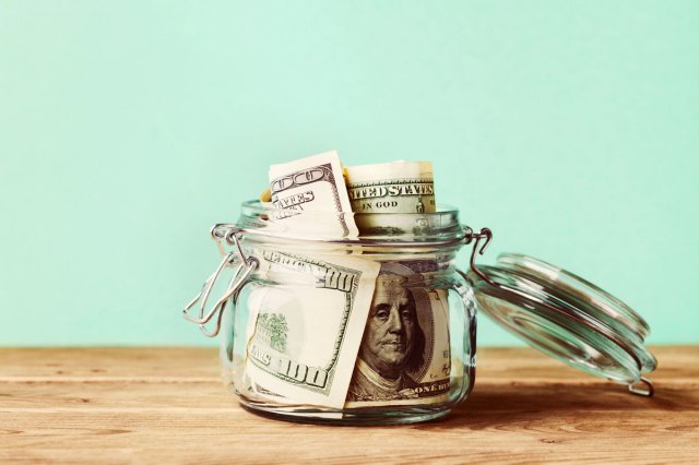 An image of cash in a jar