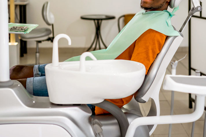An image of a man in a dental chair