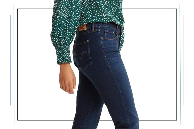 An image of a woman in blue jeans and a green top