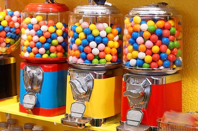 An image of four gumball vending machines