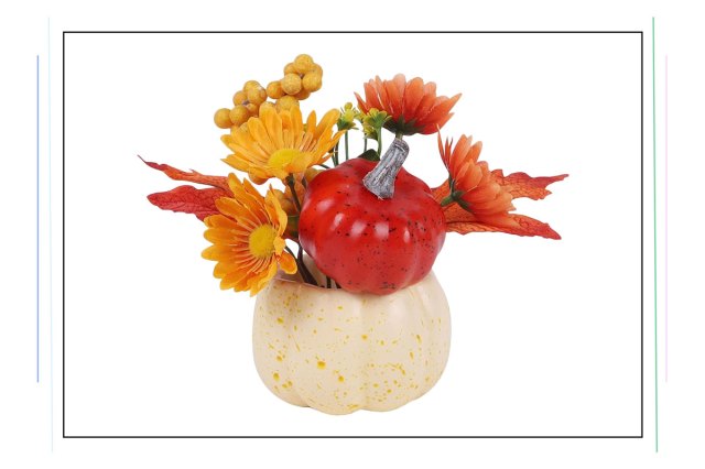 An image of an artificial pumpkin with maple leaves and flowers