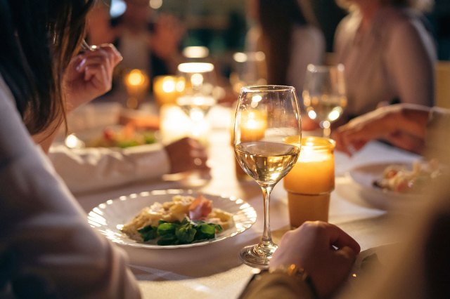 An image of people having dinner at a restaurant