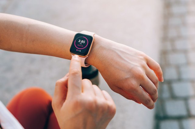 An image of a wrist with a fitness tracker on it