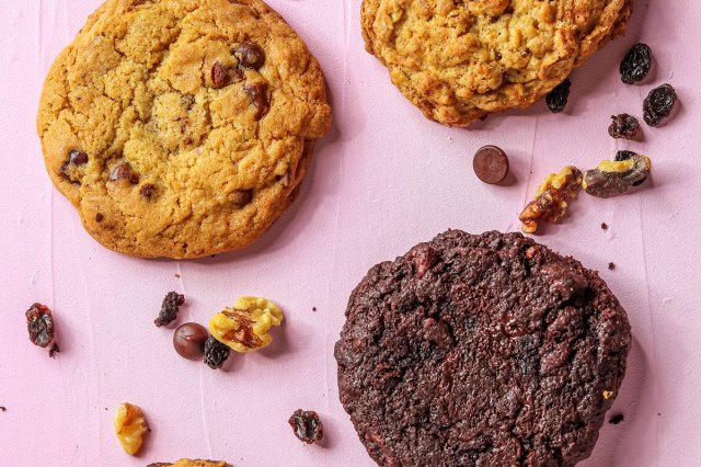An image of various cookies against a pink background