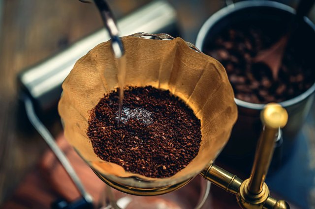 An image of coffee grounds in a coffee filter