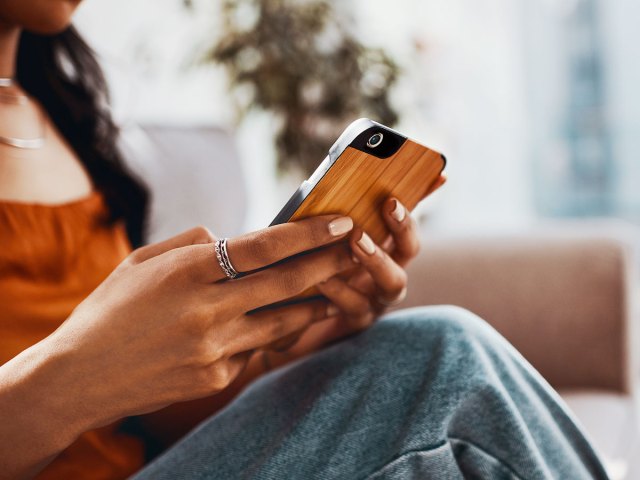 An image of a woman texting on her phone