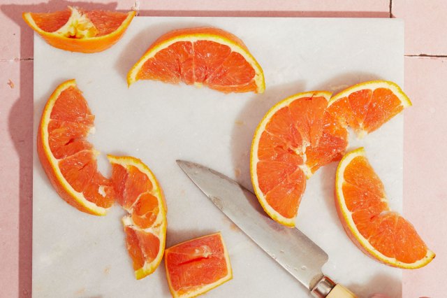 An image of orange slices on a cutting board
