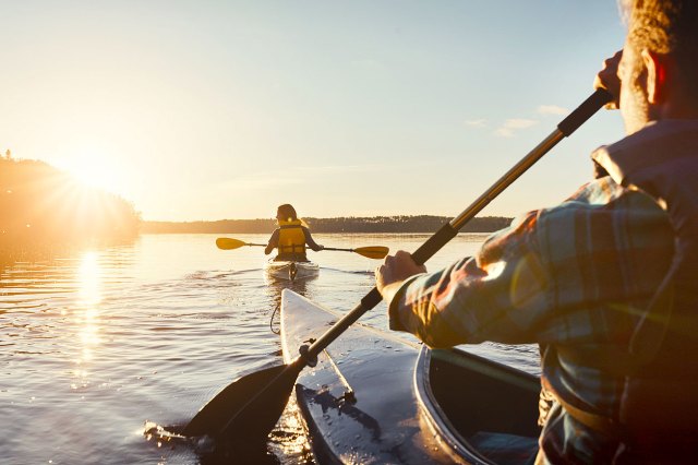 An image of two people kayaking