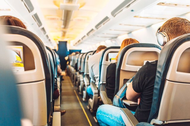 An image of people sitting on a plane