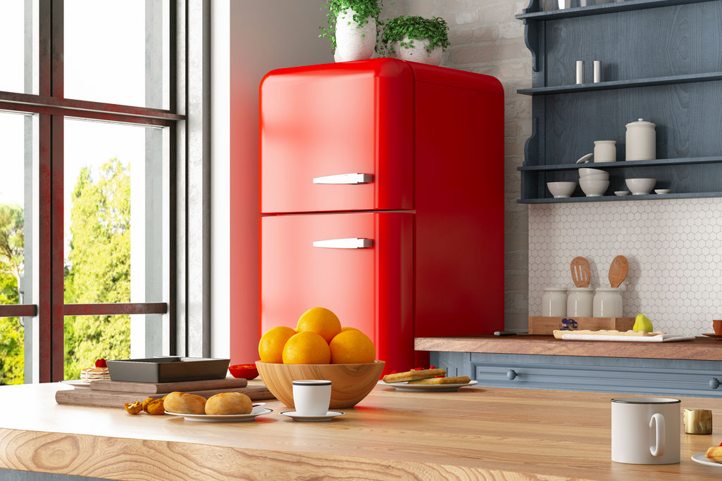 An image of a red refrigerator in a kitchen