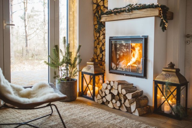 An image of a cozy living room with a fireplace