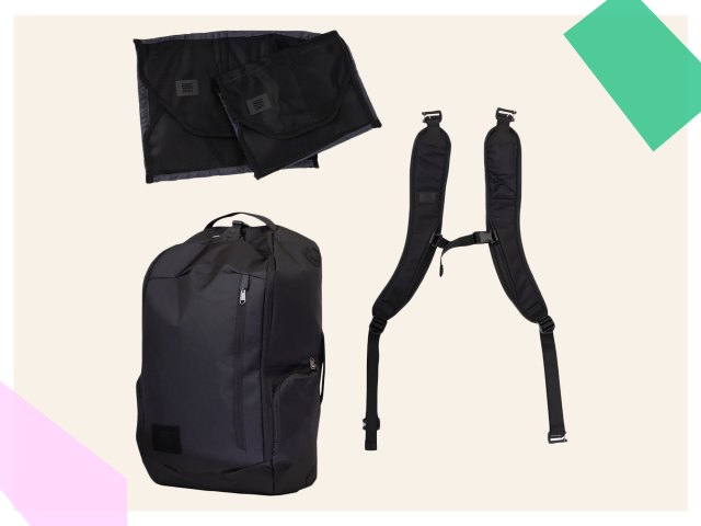 An image of a black backpack with straps and packing cubes