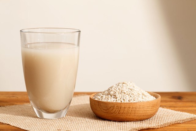 An image of a glass of rice water and a bowl of rice