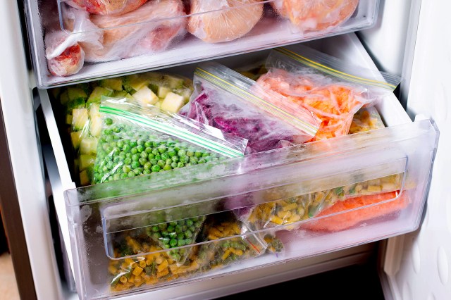 Vegetables in bags in a freezer drawer