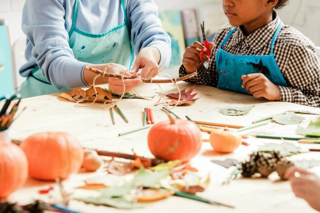 An image of a woman and child sitting at an arts and crafts table
