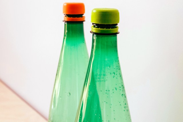 An image of two green plastic bottles