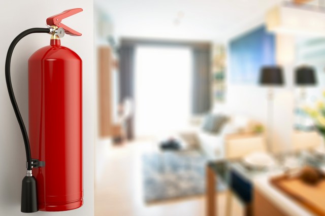 An image of a fire extinguisher hanging on a wall