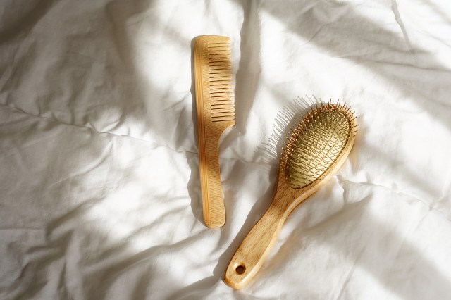 An image of a wooden hair brush and a wooden comb