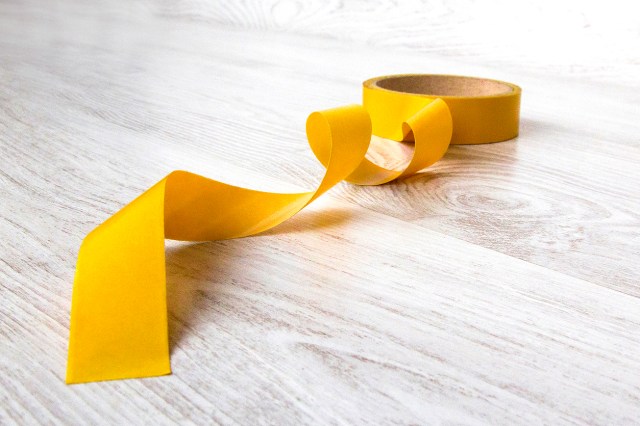 An image of a roll of yellow tape