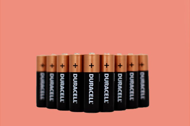An image of Duracell batteries against a dark peach background