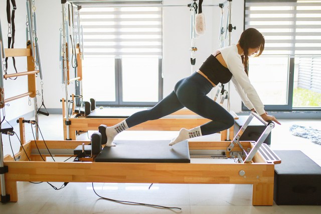An image of woman on a pilates reformer