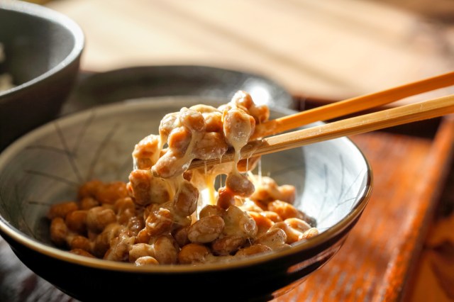 An image of a chopsticks in a bowl of natto
