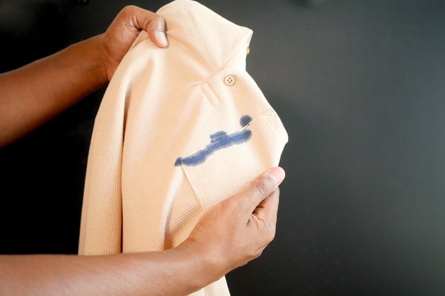 An image of a white shirt with a blue ink stain