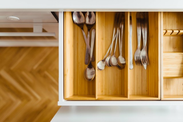 An image of an open silverware drawer