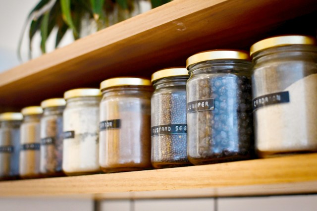 An image of spice jars on a shelf