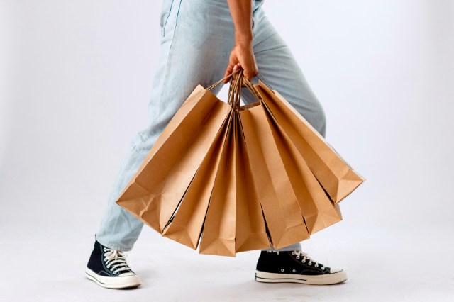 An image of a person holding multiple shopping bags