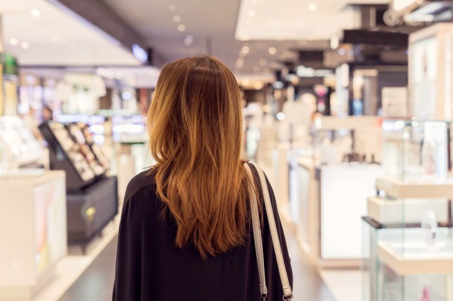 An image of the back of a woman a store