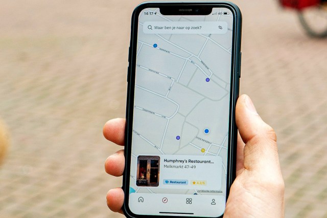 An image of an iPhone with a map on the screen