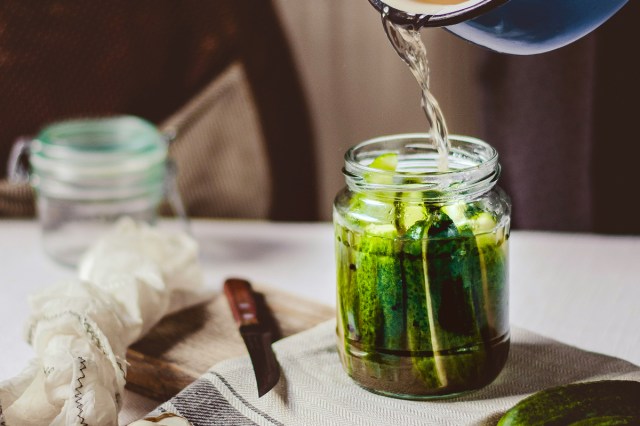 An image of liquid into a car of pickles