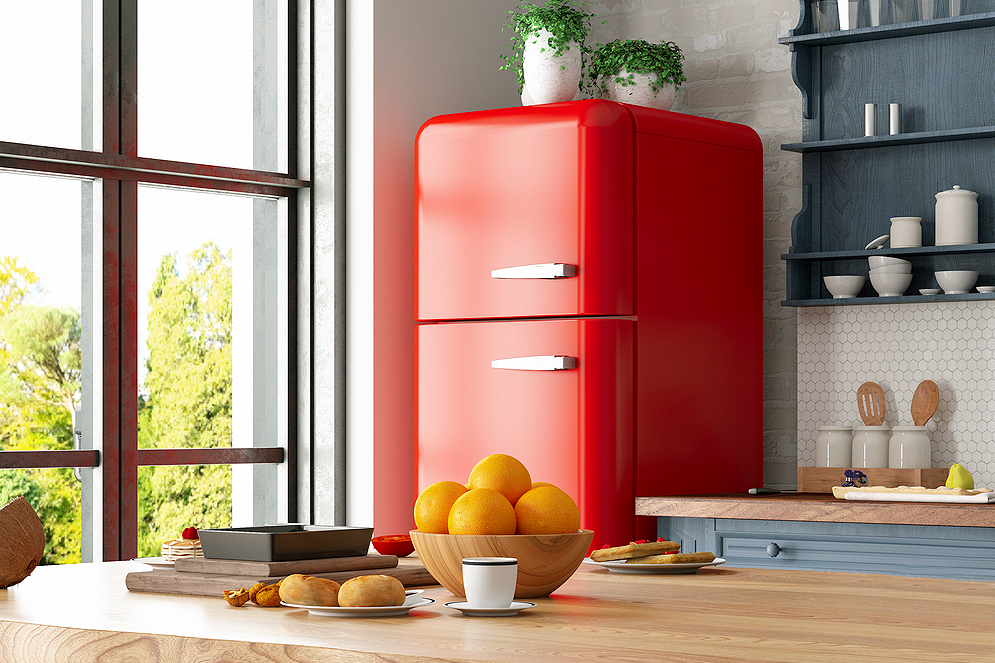 An image of kitchen with a red refrigerator, grey shelves, and wooden countertops with breakfast foods on them