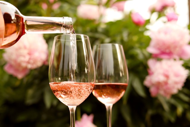 An image of a glass of rose being poured