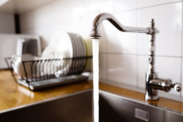 An image of a running kitchen faucet