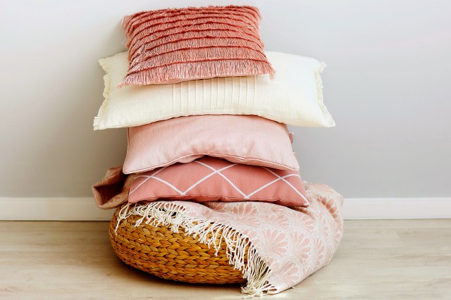An image of a pile of pillows in a basket