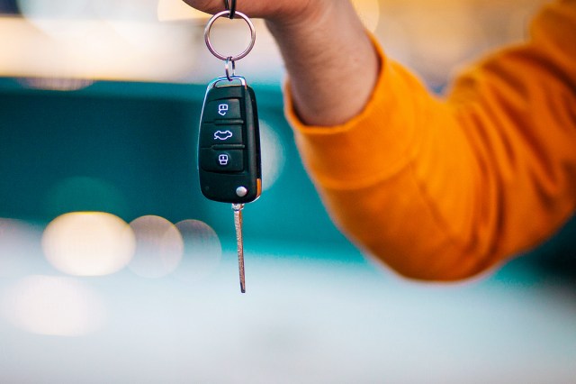 An image of a person holding car keys