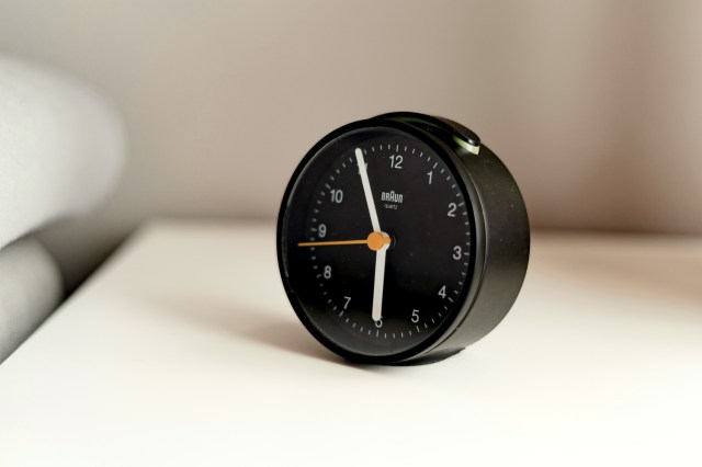 An image of a black alarm clock
