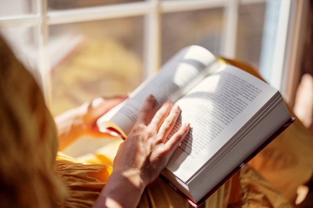 An image of a woman reading a book
