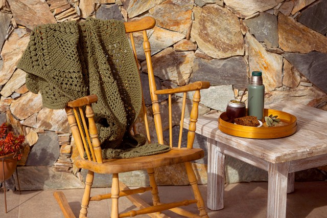 An image of a rocking chair next to a small table