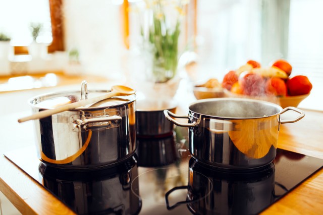 Stainless steel pots on an electric stovetop