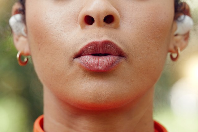 An image of a woman pursing her lips
