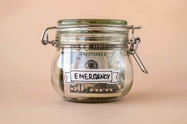 An image of money in a jar labeled "emergency"