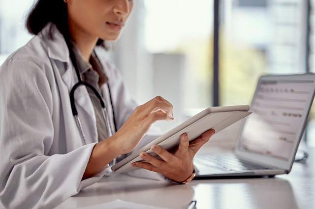 An image of a doctor on a tablet